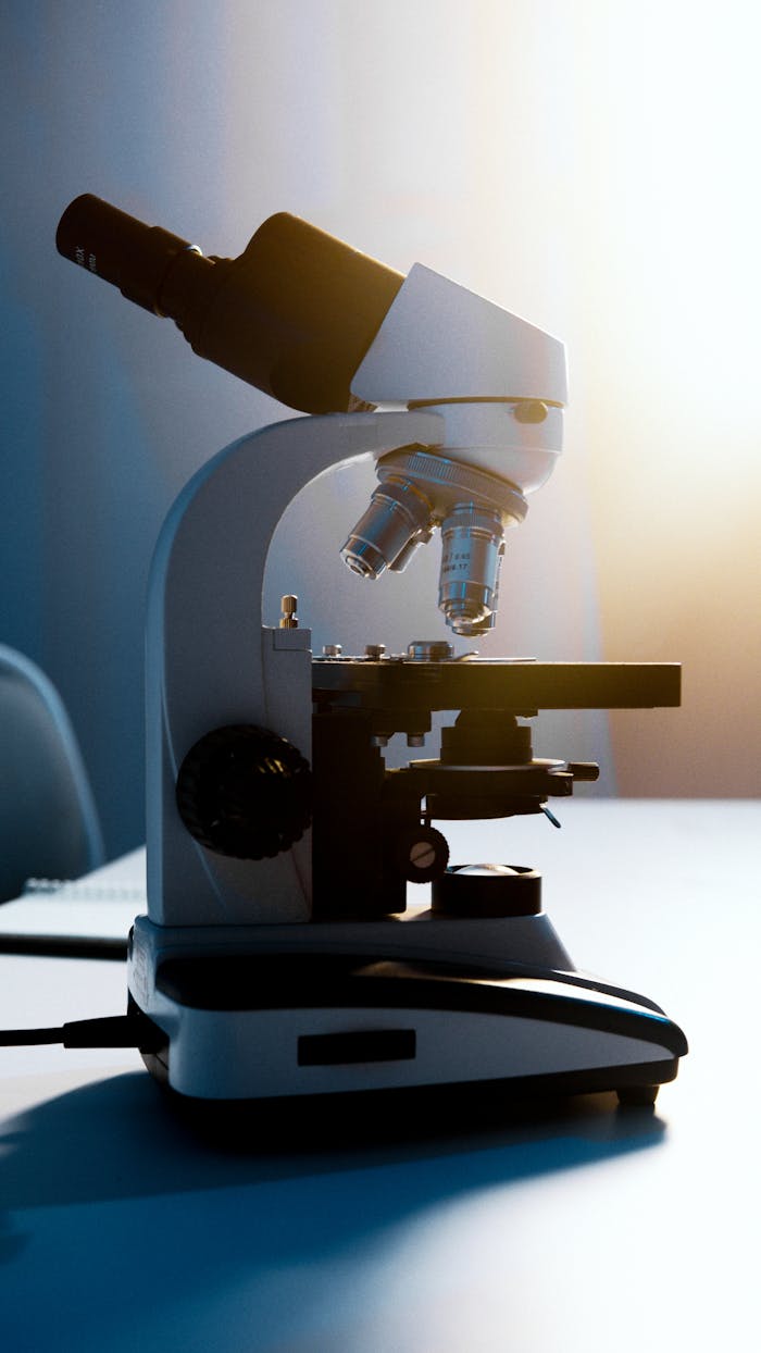 A Light Microscope Placed on a White Surface